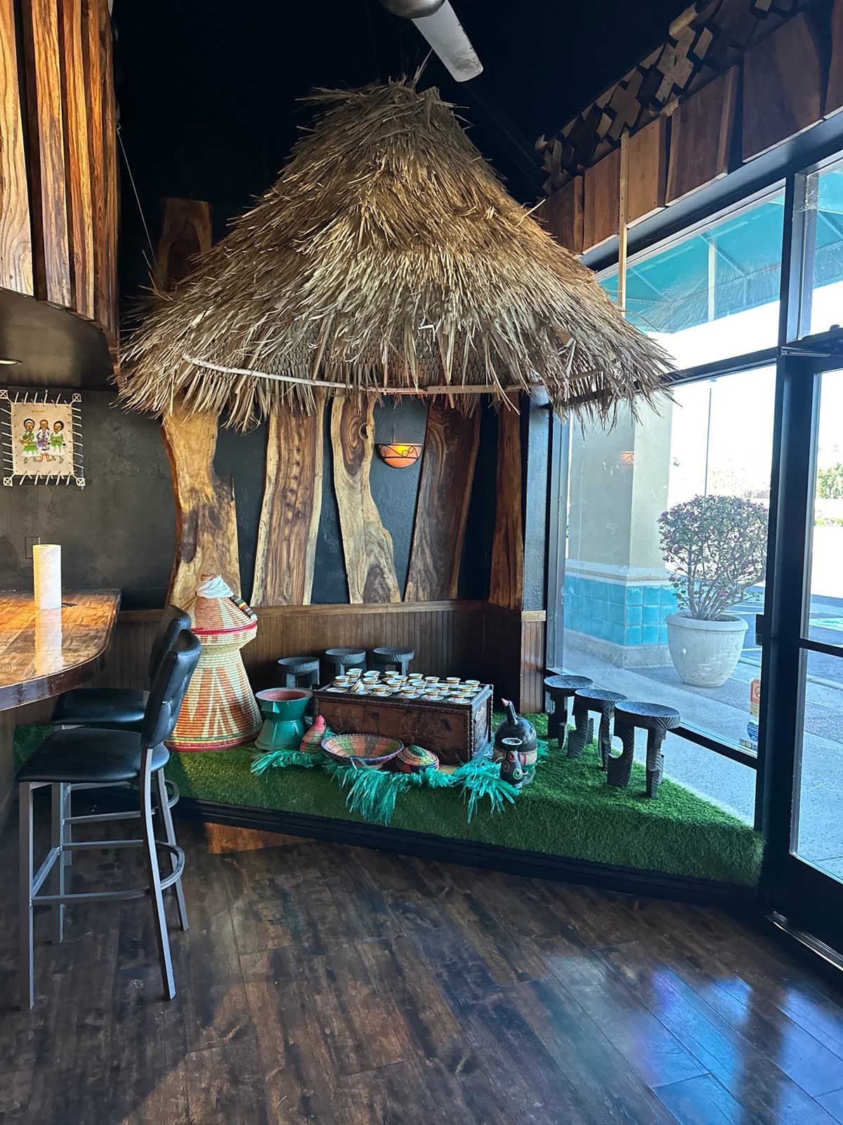 The Scottsdale dining room with a thatched hut and woven lamps